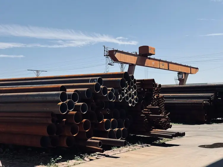 Busy steel fabrication yard with multiple jobs in progress