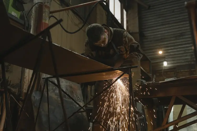 Welder working on fabricated steel components
