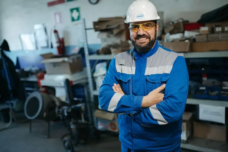 Supervisor checking job status on the workshop floor