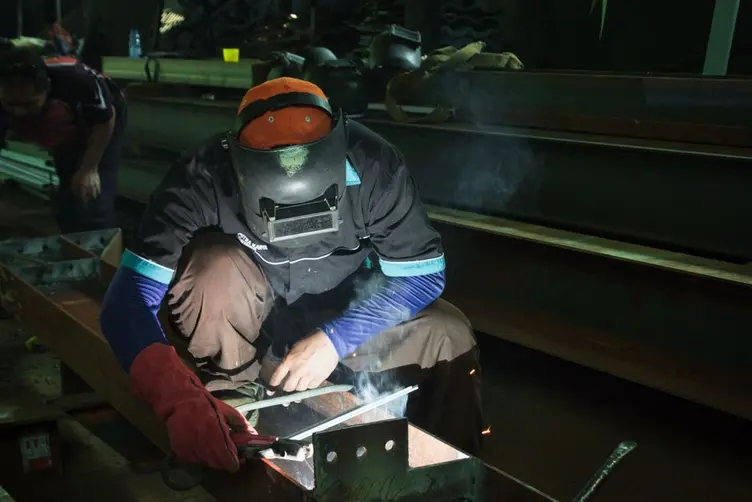 Welding paperwork and inspection documents in a workshop office