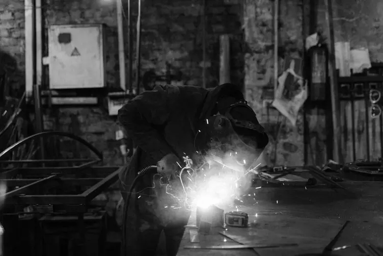 Small welding workshop using a whiteboard for job status