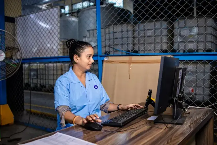Small manufacturer reviewing operations at a desk
