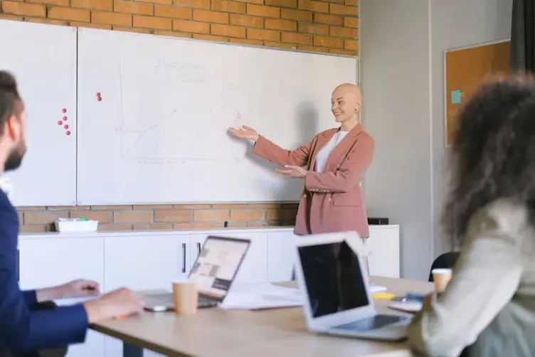 Simple whiteboard used for job tracking in a small workshop