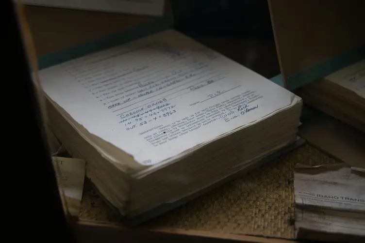 Old job folders and paperwork in a workshop office